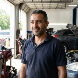 Portrait of Sami, owner of an auto repair workshop in Dubai